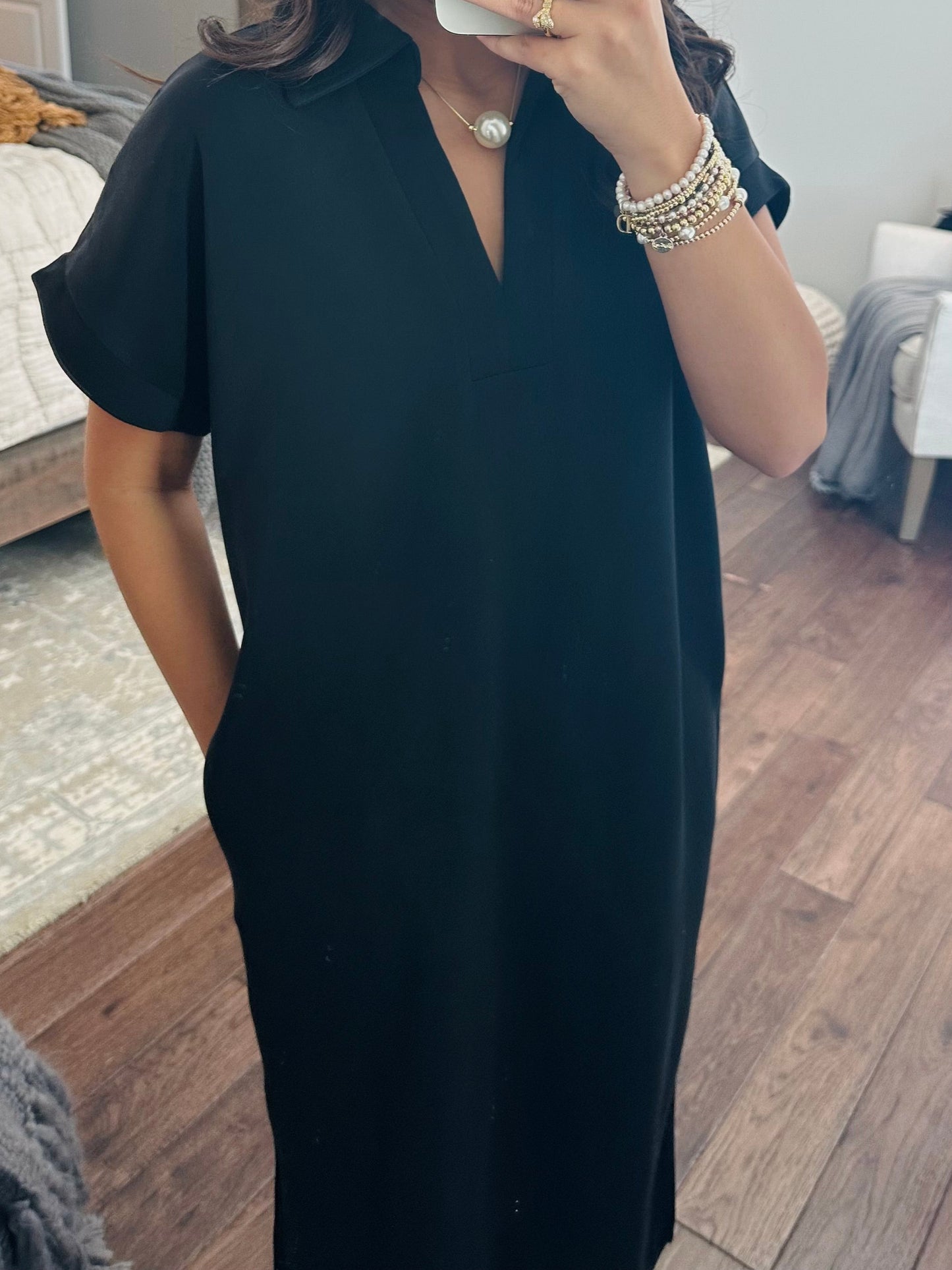 The Nola Black V-neck Midi Dress