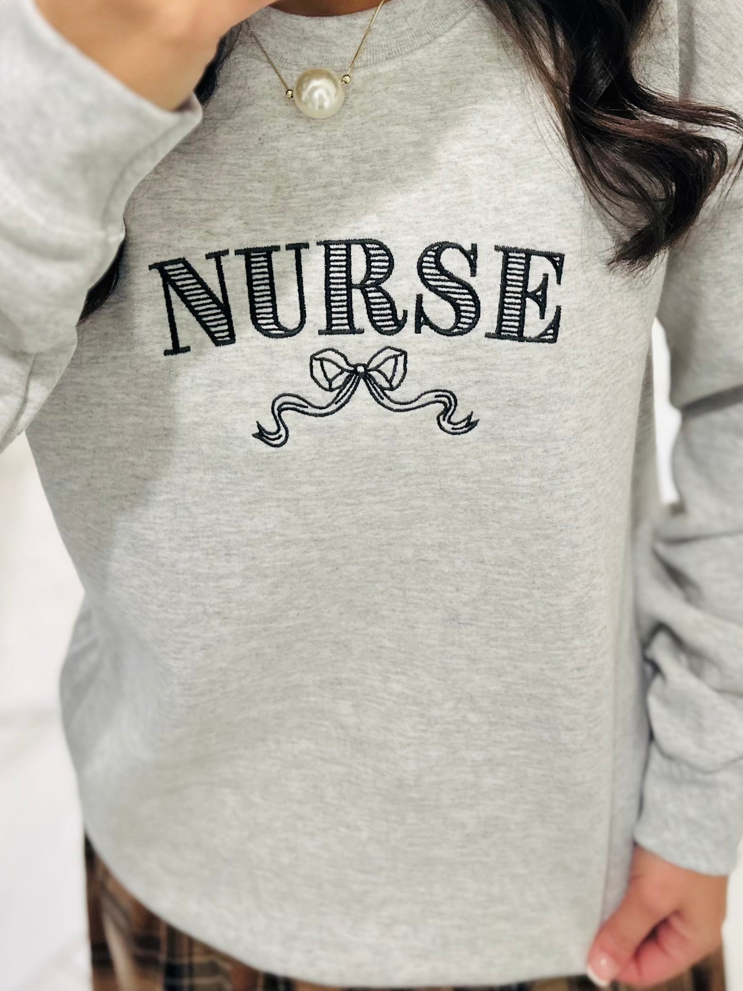 The Nurse Bow Embroidered Crewneck