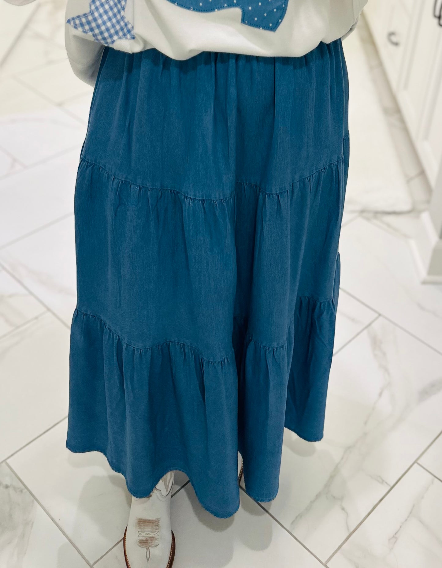 The Light Wash Denim Chambray Tiered Maxi Skirt
