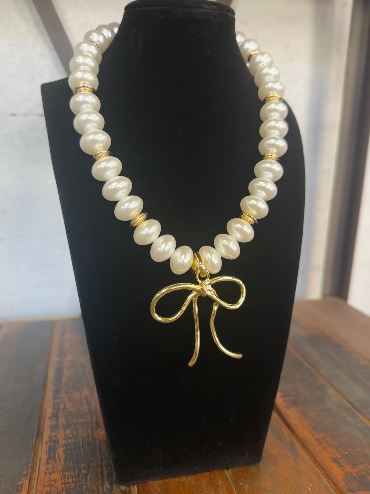 The Maggie Pearl + Gold Wide Bead Bow Pendant Necklace