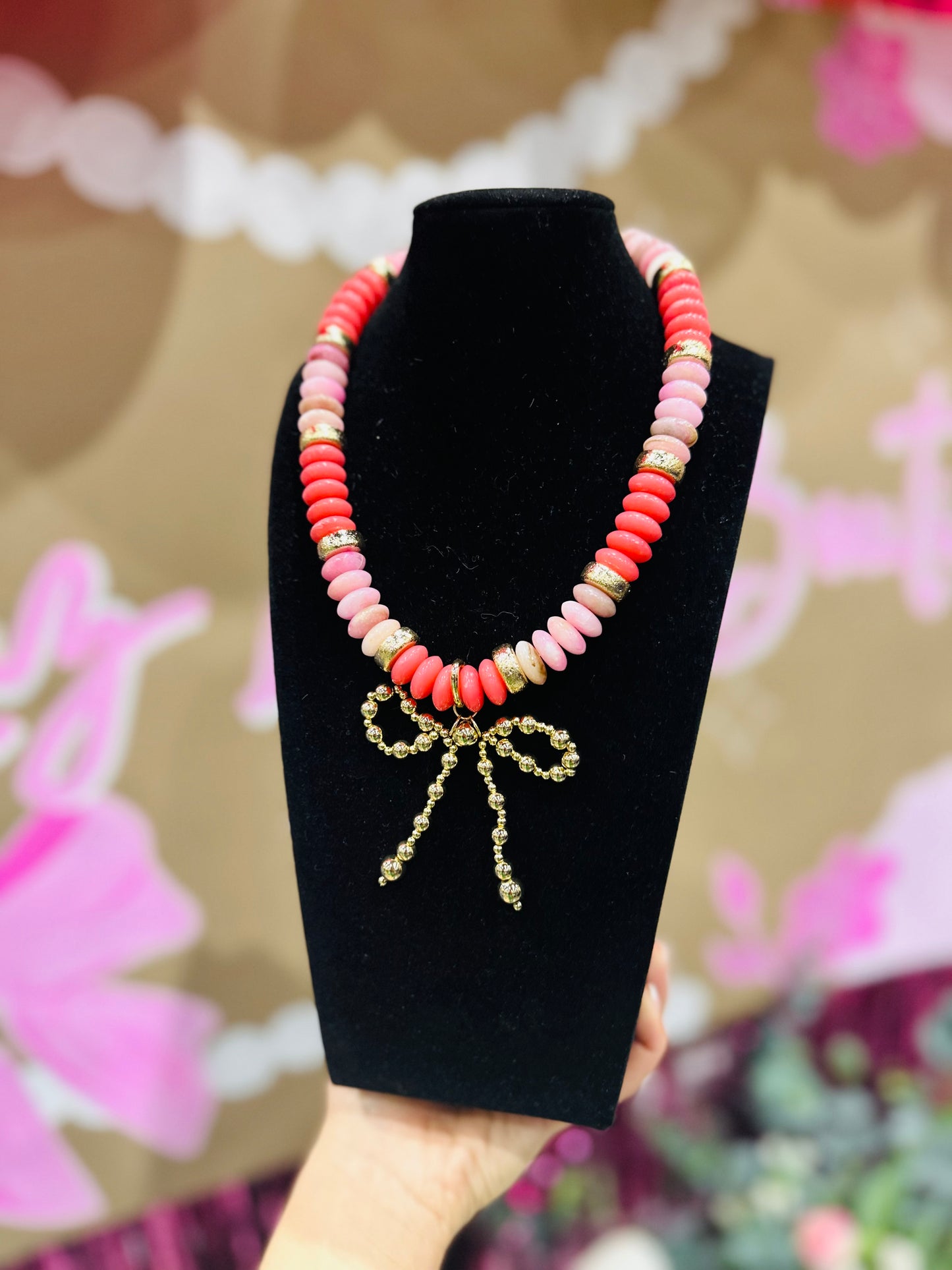 The Posie Pink + Gold Wide Bead Bow Pendant Necklace