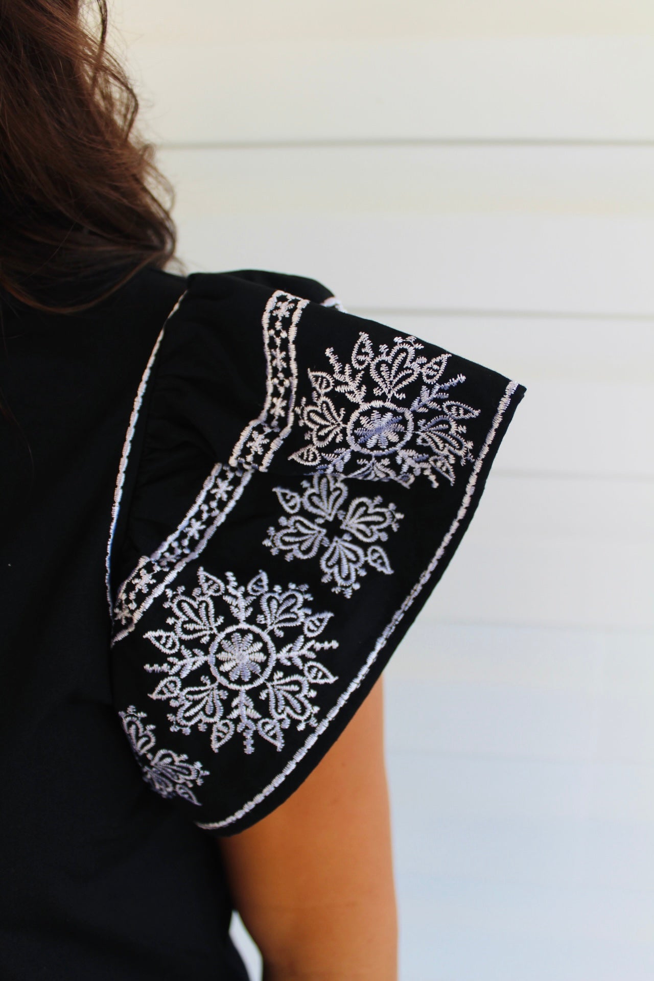 The Payton Black Embroidered Ruffled Sleeve Top