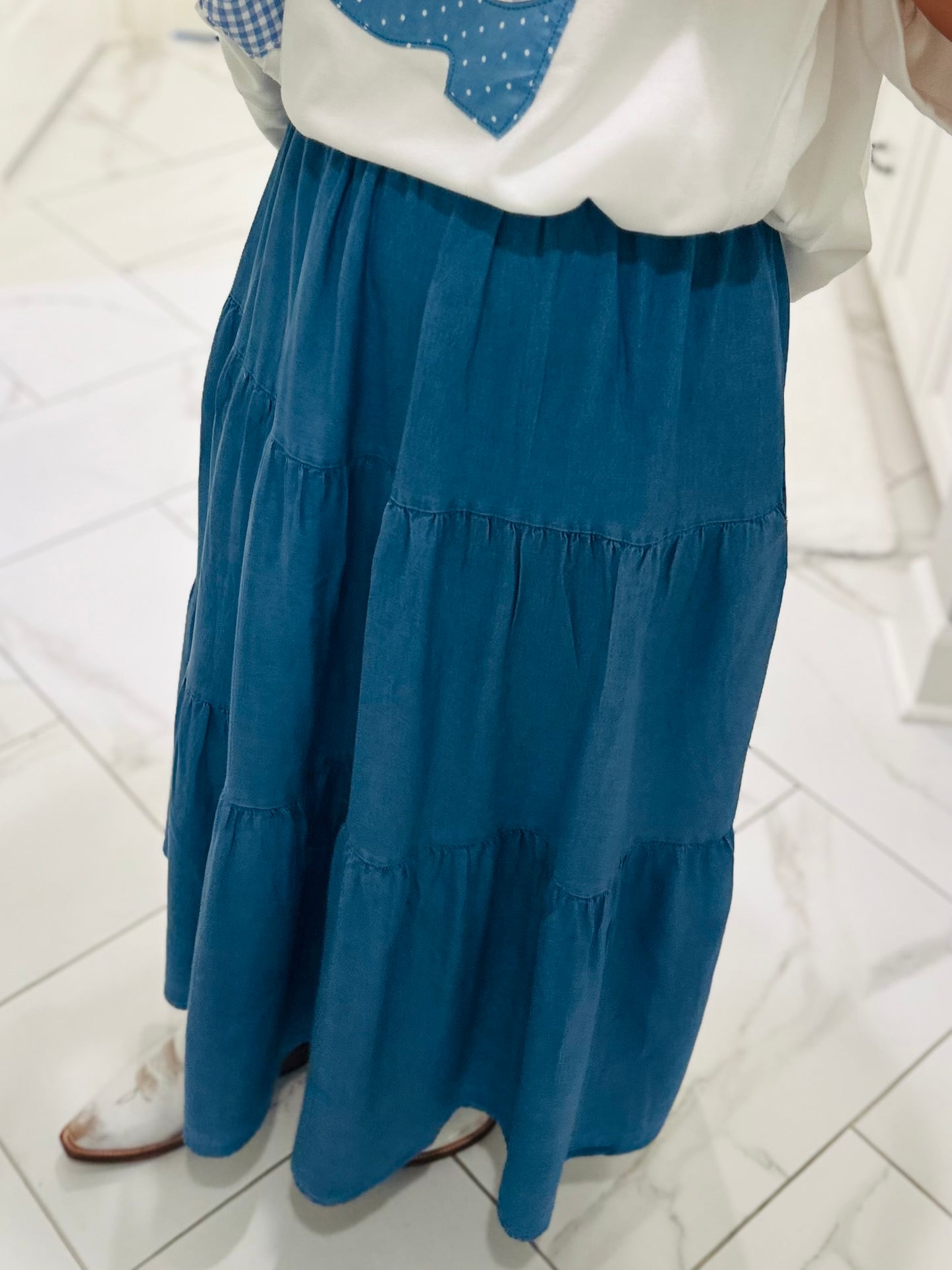 The Light Wash Denim Chambray Tiered Maxi Skirt