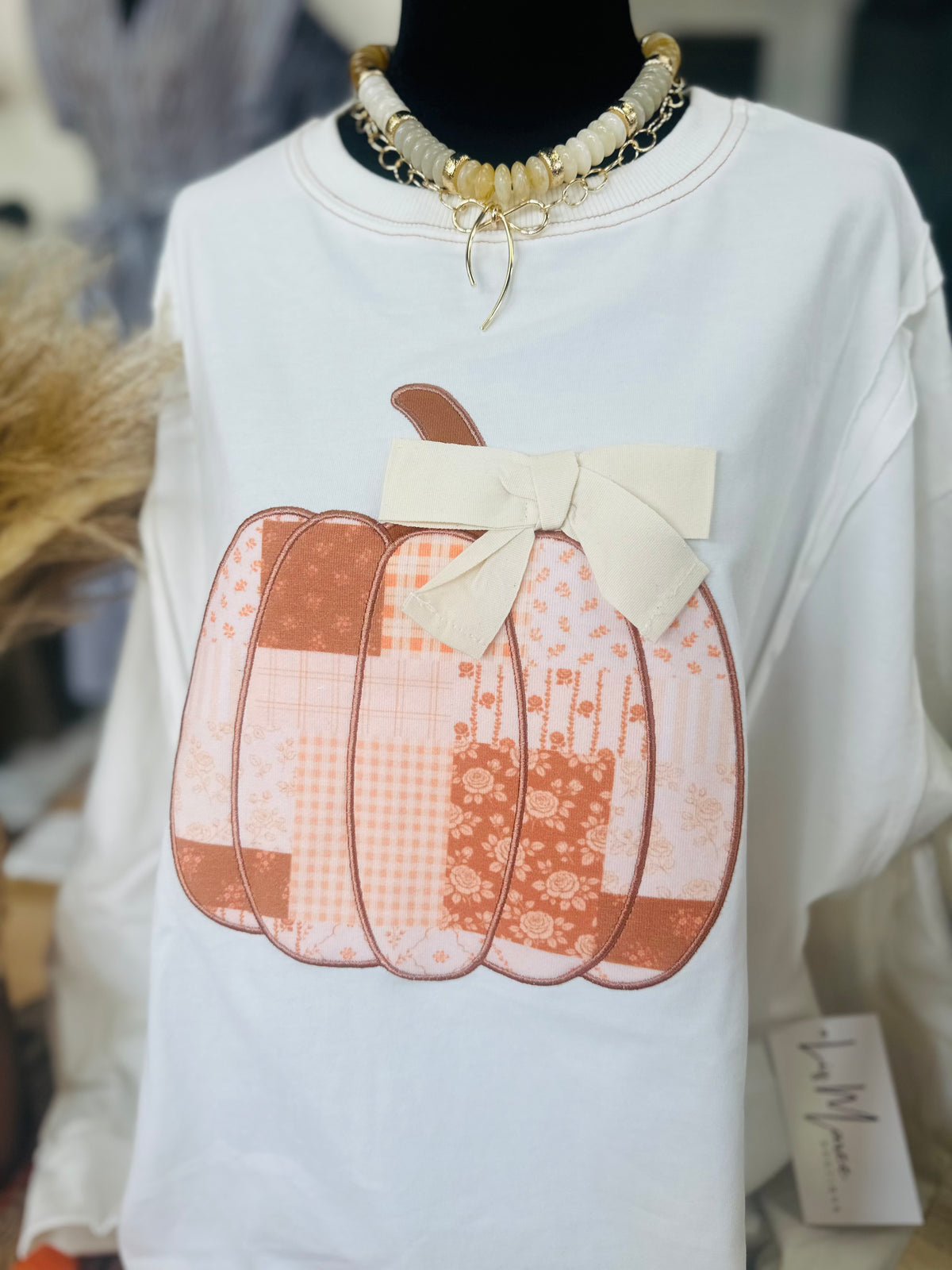 The Patchwork Pumpkin Bow Sweatshirt