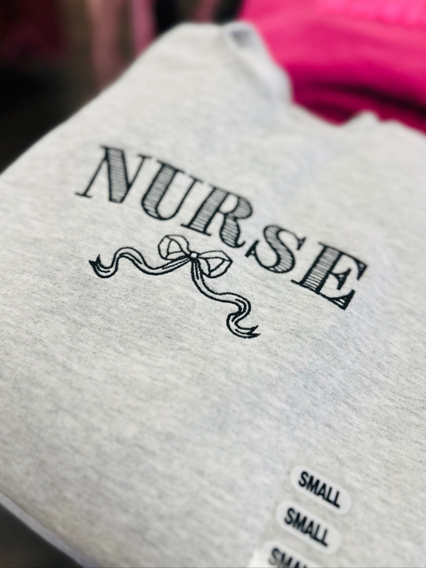 The Nurse Bow Embroidered Crewneck